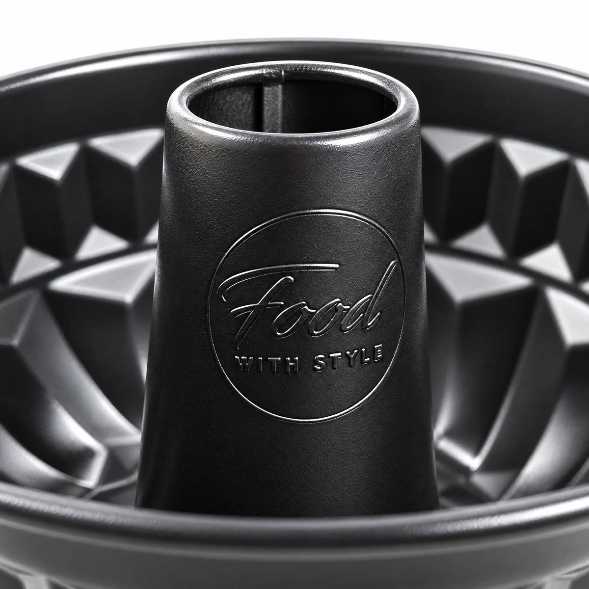 Close-up of the central tube of the Food with Style ring cake pan with the embossed logo